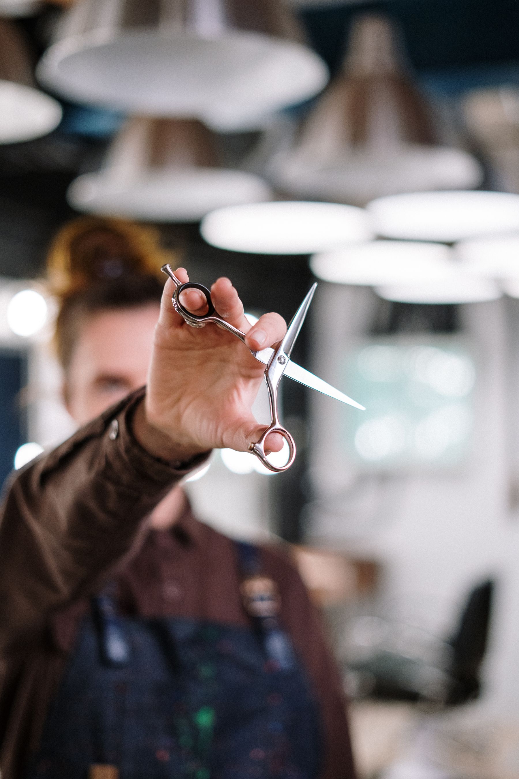 A stylist carefully working with a client's hair