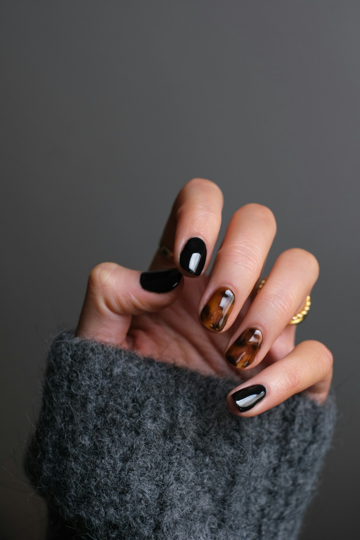 Detailed nail art and polished fingertips