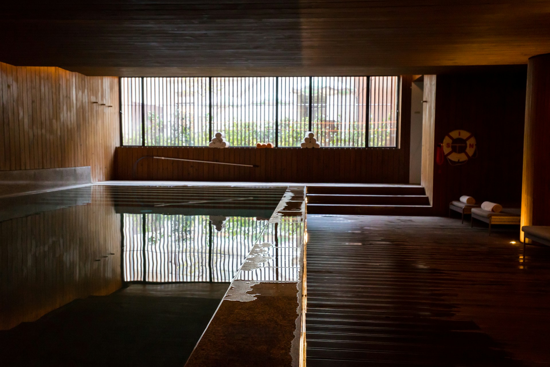 A poolside retreat with warm wood detailing
